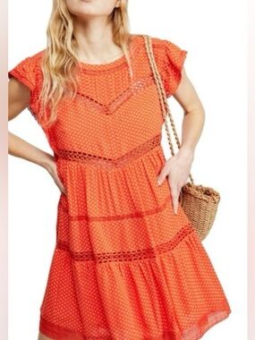 FREE PEOPLE Retro Kitty Crochet mini dress in bright orange. 37” length